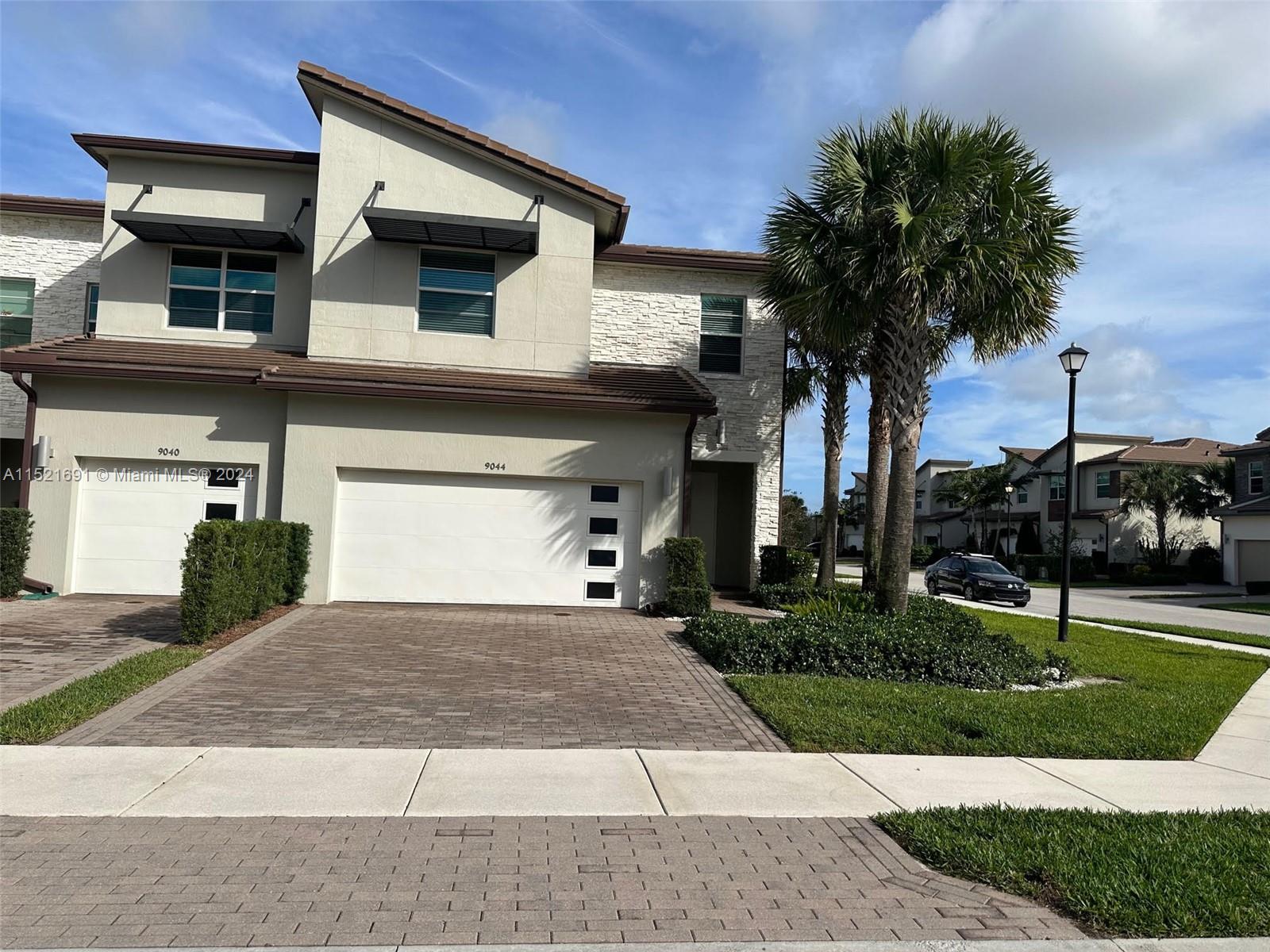 Corner Unit, 3 Bedrooms 2 1/2 Bath spacious areas with 2 car garage and great backyard. Beautiful Kitchen with granite countertop and Stainless steel appliances just freshly painted and new laminate floor. Amenity center with pool and Gym. Just few steps away there is a High School and Middle School.