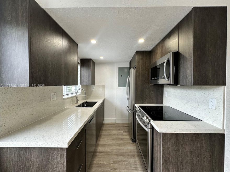 Stunning, newly-remodeled townhome in a highly desirable area of Fort Lauderdale. This 2-bed, 1.5-bath gem on the second floor boasts new wood flooring, central AC, impact windows, granite countertops, modern cabinets in the kitchen and bathrooms, and top-of-the-line, stainless steel appliances. Enjoy common areas such as a patio, picnic space, and new laundry facilities. Pet friendly building. Water, waste, sewer + 1 assigned tandem parking space included in rent. Beautiful complex nestled on a quiet street - EXCEPTIONAL LOCATION!!! Middle River Terrace offers urban convenience, lush gardens and proximity to Downtown Fort Lauderdale. Walk to nearby amenities, and it's just a 10-minute drive to Hugh Taylor Birch State Park's beach. Close to amazing restaurants, shops, parks, schools etc.