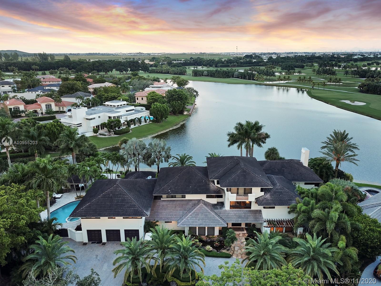 The largest contemporary mansion in Doral is now available - turnkey - for your family.
A golfer’s dream home, it is adjacent to the Trump National Golf Course.
Memberships to the 5 star golf course, resort and the Pritikin Wellness Spa are available.
The three-story luxury property has 11,676 sf, 10 BR & 10.5 BA, on its private 27,356 sf grounds.
The owners invested several millions in designer materials, furniture, fixtures, finishes and appliances.
This luxury residence is perfect for a large family and has enough space for multiple virtual offices.
One step outdoors is a private pool, barbecue and gazebo, - for lakeside gatherings.