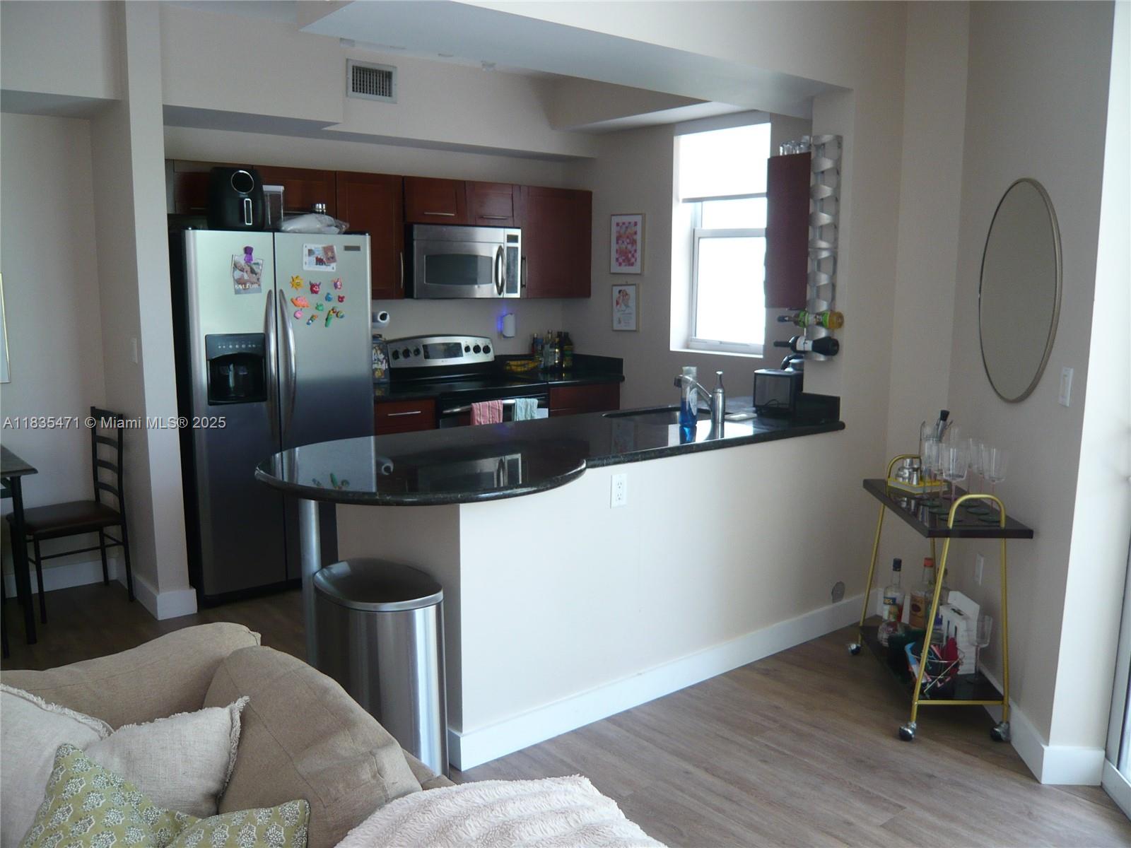 Urban living in Downtown Dadeland. Best Price and Best location, corner unit overlooking the interior street intersection and shops from your balconies. This unit is among the largest 2/2 at 1322 adj. sq.ft. and it is situated on the second floor where the inner garden is located. Features newer flooring, washer/dryer inside unit, S/S appliances granite counter tops, impact windows, spacious bedrooms and California closet. No need for a car, Walk to the shops, restaurant, Publix, Dadeland Mall and the Metrorail can take you to University or to Downtown BRICKELL. You also have a 1 car assigned covered parking. Basic cable and internet are included in the rent. Complex offers Secure Building w/24 HR security, pool, gym, spa and more. Don't miss out on this most sought out Condo.