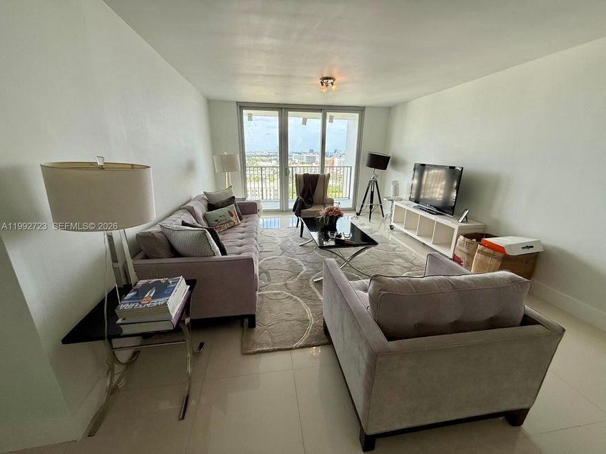Beautiful 2BR/2BA residence on the 21st floor at The Commodore in the heart of Aventura. Fully furnished & truly move-in ready, featuring a bright open-concept living/dining area with floor-to-ceiling windows, abundant natural light, and tile floors throughout. Modern kitchen with dark cabinetry, granite countertops, stainless steel appliances, and recessed lighting—clean, functional, and great for entertaining. Spacious primary suite with ample closet space plus a well-sized second bedroom ideal for guests, kids, or a home office. 1,058 SF plus a large balcony with open skyline/city views—perfect to enjoy sunrise coffee or evening breezes. Includes 1 assigned parking space. Well-maintained building with great amenities and a prime location close to Aventura Mall, parks, restaurants, houses of worship, and just minutes to Sunny Isles beaches. Easy access to major highways.