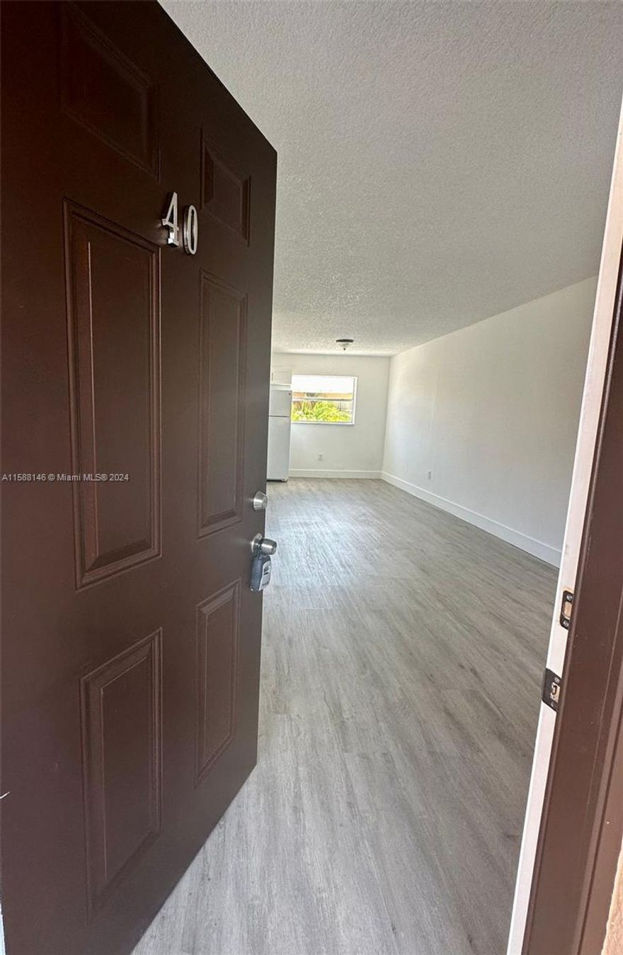 Centrally located, beautiful completely remodeled 3/1.5 apartment with washer/dryer inside and 2 parking spaces. Close to shopping, schools, supermarkets.