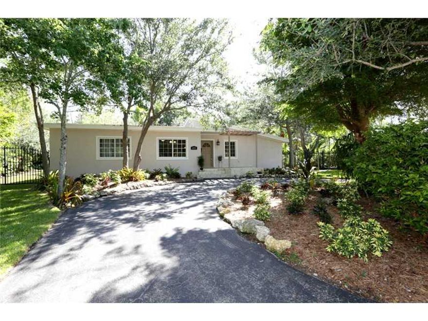 Enjoy fishing, canoeing, and relaxing on this rarely available home on pristine and private Coral Lake. Located on a lovely, secluded street minutes from Coral Gables, South Miami, and in top-rated David Fairchild and South Miami school district. Sunlit h ome offers a great open layout. Impact windows, brand new kitchen, big walk-in master closet, and in a no-flood zone. Fenced and private 17,000+ sq. ft. lot is wide and deep and has plenty of room for a pool.