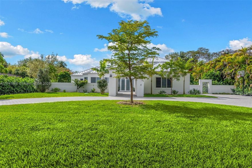 Excellent location with A+ schools. Stunning Coastal-Med style home on a Builder's Half Acre in a private quiet cul-de-sac. Completely renovated with fine finishes and ready to move-in! New porcelain floors, metal roof, 3 central AC's, Comm Well Water Purifying System, Impact windows and doors, hurricane proof garage doors, gourmet wood granite kitchen with SS appliances, brick pavers driveway and pool/patio area. This custom built home's 4 bed/3.5 bath located on the 1st level with the Primary Bed/bath occupying 2nd level for privacy. Formal living, dining and family room with lots of natural light and relaxing comforts. Spacious layout for entertaining and a growing family.