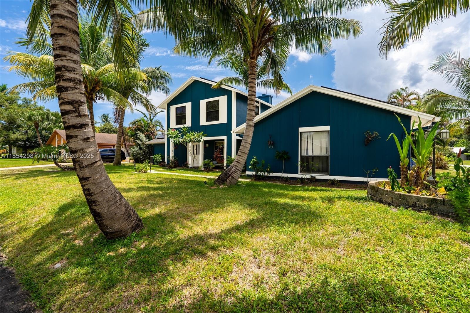 Step into this charming mid-century home, perfectly situated on a spacious corner lot in the heart of West Palm Beach. With four bedrooms and a generous family room, this residence offers plenty of space. The updated kitchen is warm and functional, while the oversized master bedroom features its own en suite bath for added privacy. The additional bedrooms are also nicely sized, offering flexibility for guests, or a home office.
Outside, you’ll find a beautifully landscaped yard adorned with iconic palm trees that perfectly capture the Florida lifestyle. This home is centrally located just minutes from the airport, beaches, schools, I-95, and the Florida Turnpike. Whether you're looking for a family home or a property with great potential to personalize, this one is a must-see.