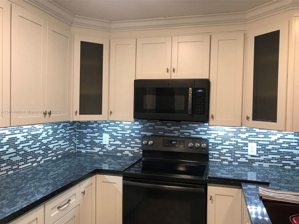 Photo of 6734 N Pine Island Rd, Tamarac, FL 33321 (MLS # A11414986)