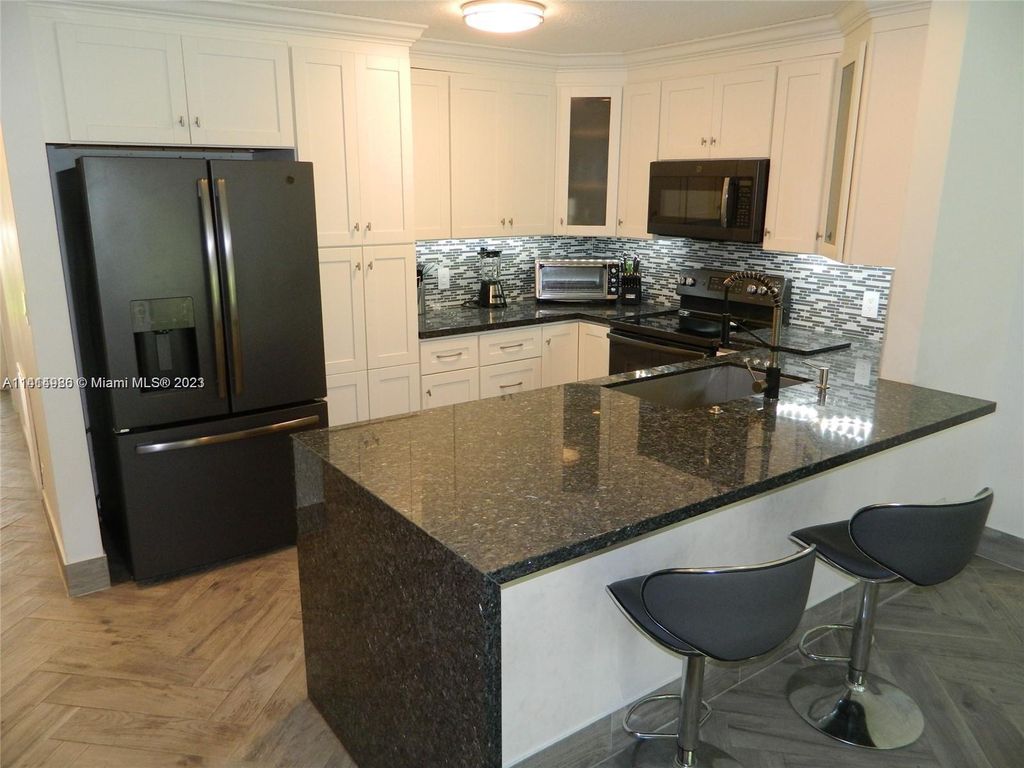 Photo of 6734 N Pine Island Rd, Tamarac, FL 33321 (MLS # A11414986)