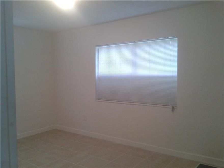 Freshly painted interior walls. Newly placed kitchen cabinets with easy to clean countertops.Updated bathroom fixtures. Beautiful tile floors thorughout the property. Great sized pool in the backyard . Will not last call right away!!