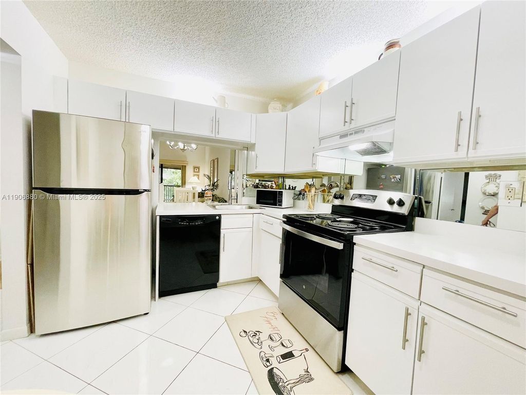 Photo of 3137 S Carambola Cir #2369, Coconut Creek, FL 33066 (MLS # A11906880)