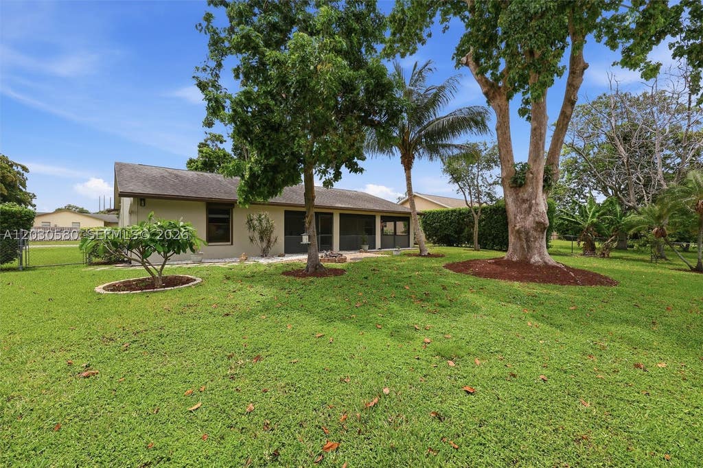 Photo of 107 Starling Ave, Royal Palm Beach, FL 33411 (MLS # A12030580)