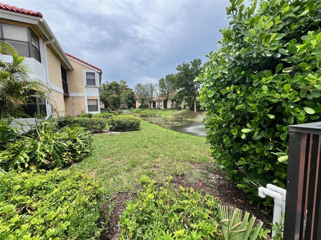 Photo of 5861 Riverside Dr #203A2, Coral Springs, FL 33067 (MLS # A11822387)