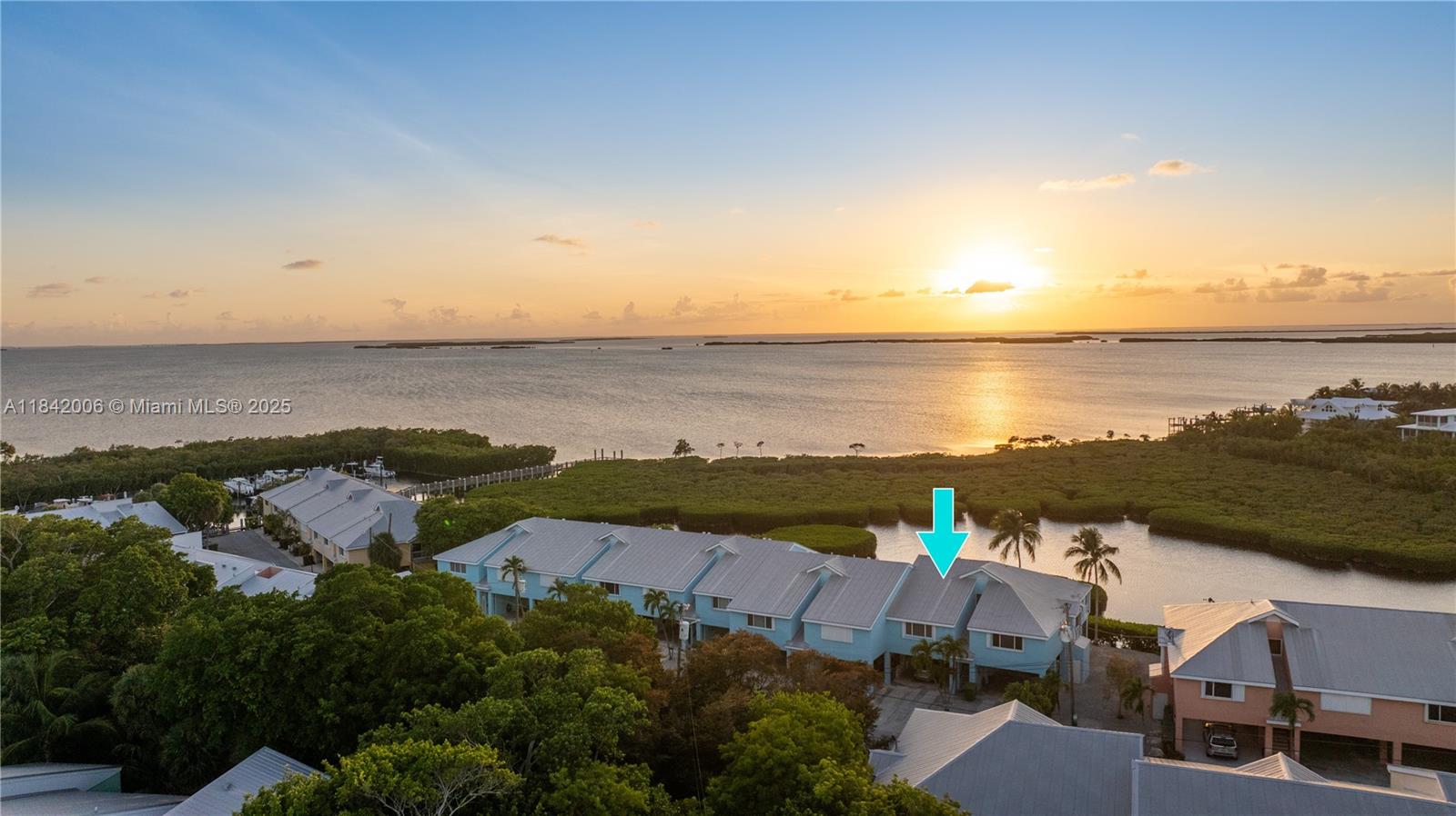 Introducing this stunning 2-bedroom, 2-bathroom townhouse that boasts spectacular views of the Florida Bay, where breathtaking sunsets turn your evenings into a magical experience. Relax on your pop-out balcony, enjoying the serenity it offers. This incredible feature is complemented by roll-down screen shades, providing added convenience. Just a few steps from your front door, you'll find your very own 30-foot deeded boat slip #47, complete with a 12k boat lift, ready to launch you into paradise. Plentiful covered parking, a generous screened patio perfect for al fresco dining, and ample storage located beneath your unit. Located at Mile Marker 98, Landings of Largo is a gated oasis that appeals to both families and boating​​‌​​​​‌​‌​​​‌‌​​​‌‌‌​​‌​​‌‌​​​​ enthusiasts.