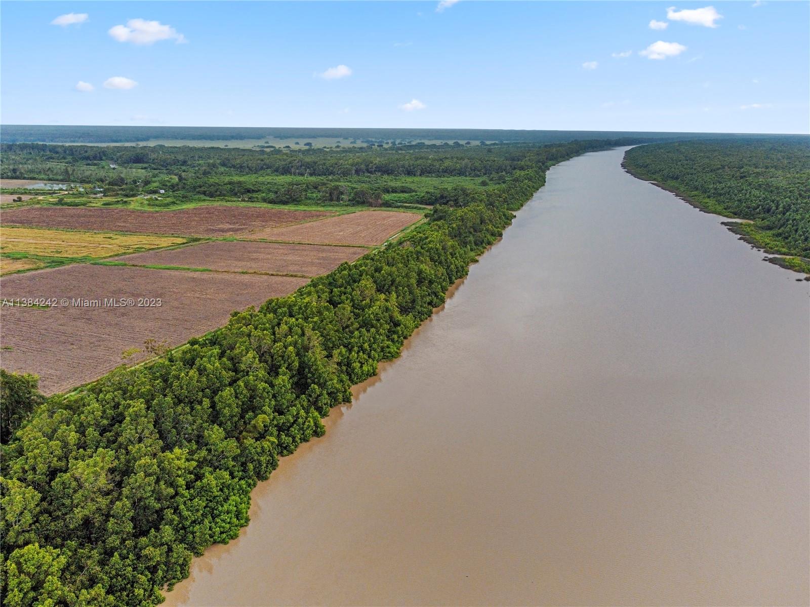 Immense opportunity to own this 54 acre lot at the Courantyne River just off the coast of Guyana and Suriname, South America. The plot is 360.9 ft. wide and approximately 1.24 miles long. Meanwhile, the immediate location of the basin has become the focal point of a major South American oil boom. In this way, the Stabroek area in Guyana and the Surinamese block 58 continue to reveal significant oil reserves, while the Demerara and Berbice blocks also show enormous agricultural potential. Numerous oil & gas companies are active near the mouth of the Courantyne River between Suriname and Guyana. Both water and electricity are connected to the plot, which is easily accessible via dirt roads. Get the unique advantages of this rarely available parcel.
