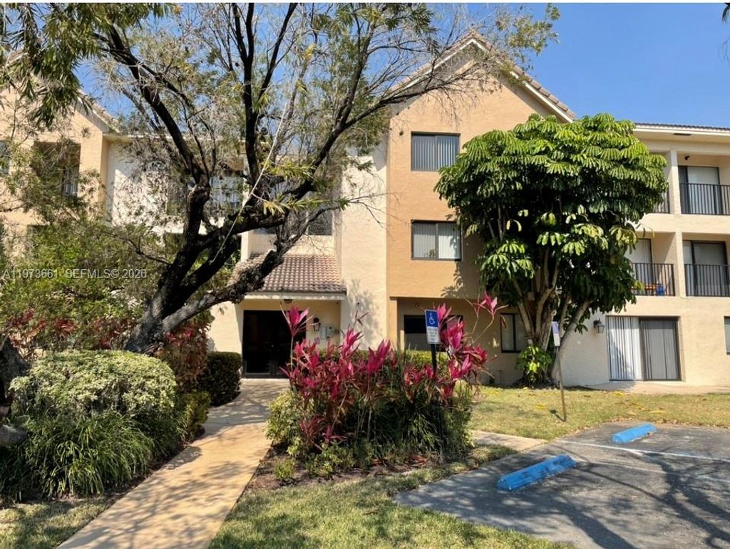 Photo of 10001 W Atlantic Blvd #122, Coral Springs, FL 33071 (MLS # A11973661)