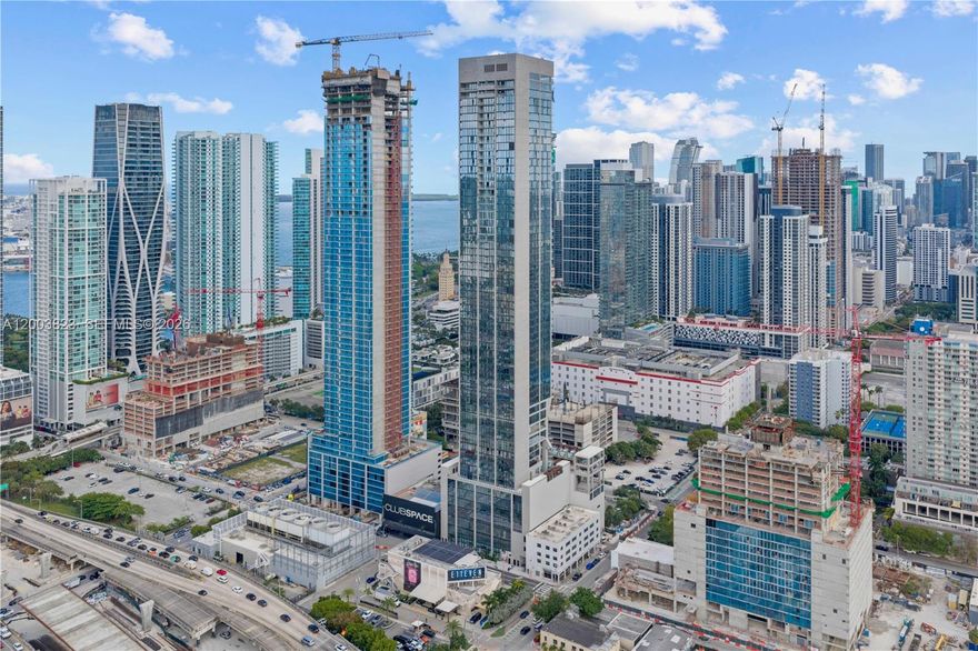 Welcome to one of the most iconic new towers to grace Downtown Miami, ideally positioned in the heart of Miami Worldcenter, one of America’s largest and most transformative urban developments. Surrounded by premier dining, luxury shopping, museums, sports, and entertainment, this location places you at the center of everything Miami has to offer.

Directly across from E11EVEN Miami and designed for an elevated lifestyle unlike anything else in the city, this landmark residence redefines luxury living. Residents enjoy world-class amenities including the Deepak Chopra Mind-Body Zone, rooftop dining by Riviera Dining Group, creators of MILA, sportsbook lounge, fitness center, resort-style pools, live entertainment, concierge, private beach club access, and nightclub privileges.

This open floor plan residence offers 2 bedrooms and 2 bathrooms with incredible views of Biscayne Bay, the Signature Bridge, and Downtown Miami skyline. Floor-to-ceiling glass fills the home with natural light and dramatic city and water views by day and night.

Features the highly desirable OS&E package with hotel program eligibility. Fully furnished with designer furnishings, elevated finishes, and turnkey details throughout.

An exceptional opportunity for personal enjoyment, short-term rental income, or long-term investment in one of Miami’s most dynamic destinations.