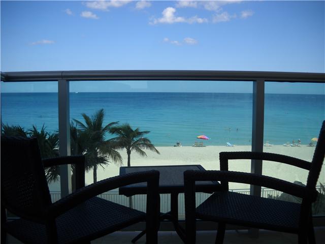 Unfurnished or Furnished. Direct ocean view!!! Short Term $3,200/Month. This is the best deal on the beach. Beautiful 2 Bed and 2 full baths, big balcony, great view over the ocean. Open kitchen, marble floors, washer and dryer in the unit. Building has g reat amenities, ocean front heated pool, gym, bbq, spa, aerobics room, front desk with 24hr security and much more!! Rent includes a/c, water and basic cable. Full furnished apartment.