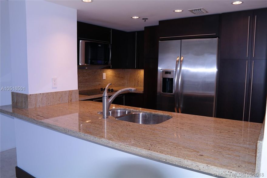 Completely remodeled 2 bed, 2 bath unit with ocean view in private Brickell Key Island. Granite kitchen counter with stainless steel appliances. New remodeled marble bathrooms, new French doors in the whole apartment. A short distance to Brickell City Center Shopping Mall, the finest restaurants and entertainment. Amenities include pool with BBQ area, tennis courts and more. Basic cable included.