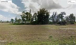 Residential lot for building a house in Cape Coral, known for its inviting community atmosphere. The lot offers a beautiful canal view, enhancing the charm and appeal of the property. Spanning a generous size, this lot provides ample space for constructing your dream home, complete with potential outdoor living areas to take advantage of the water views. Imagine relaxing on your patio, enjoying sunsets over the canal, or engaging in water activities right from your backyard. Cape Coral is renowned for its extensive network of canals and waterways, making this lot ideal for boating, fishing, or simply enjoying the serene water scenery. The surrounding neighborhood features well-maintained homes, parks, and convenient access to local amenities, including shopping, dining, and schools.