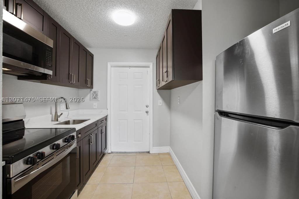 Photo of 850 E Commercial Blvd #214B, Oakland Park, FL 33334 (MLS # A12071475)