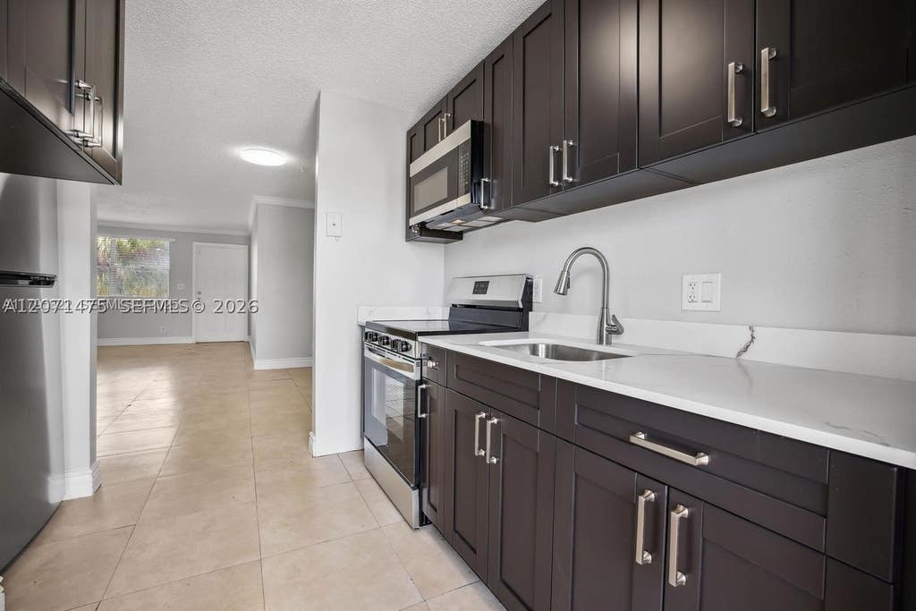 Photo of 850 E Commercial Blvd #214B, Oakland Park, FL 33334 (MLS # A12071475)