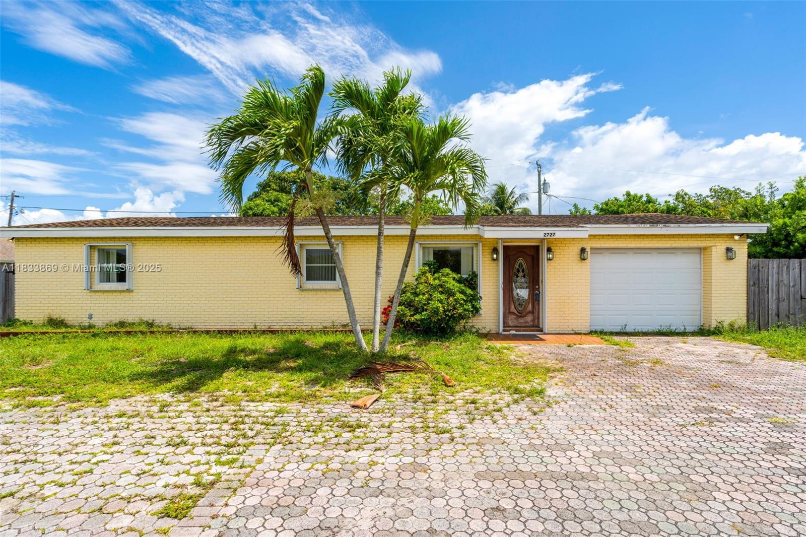 This 2-bedroom, 2-bath single-family home offers solid bones and endless potential for renovation. Situated on a generous lot with mature fruit trees, the property features a spacious layout, attached garage, and circular driveway. While the home requires updates throughout, it presents a fantastic canvas for investors, flippers, or buyers. No HOA and centrally located near I-95, shopping, dining, and beaches.