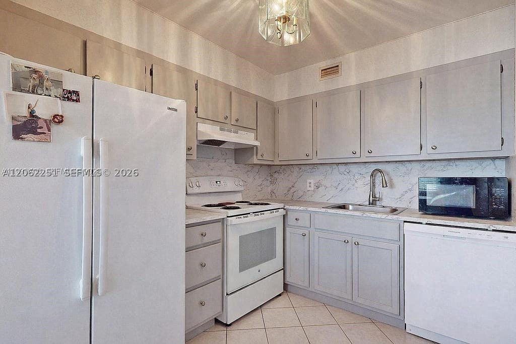 Photo of 13450 SW 3rd St #408D, Pembroke Pines, FL 33027 (MLS # A12062251)