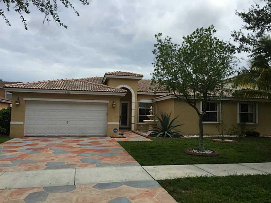 WOW!  BEAUTIFUL 4 BEDROOM COQUINA HOME READY TO MOVE IN.   CUSTOM TILE THROUGHOUT.  GRANITE KITCHEN WITH STAINLESS STEEL APPLIANCES.   MANY UPSCALE FEATURES.   VERY BRIGHT AND SPACIOUS.  FENCED BACK YARD WITH FRUIT TREES.  SCREENED PATIO.  ACCORDIAN SHUTT ERS.   SHORT WALK TO COMMUNITY POOL.  COMMUNITY ACROSS FROM PROMENADE SHOPPING/DINING.  GREAT SCHOOLS.