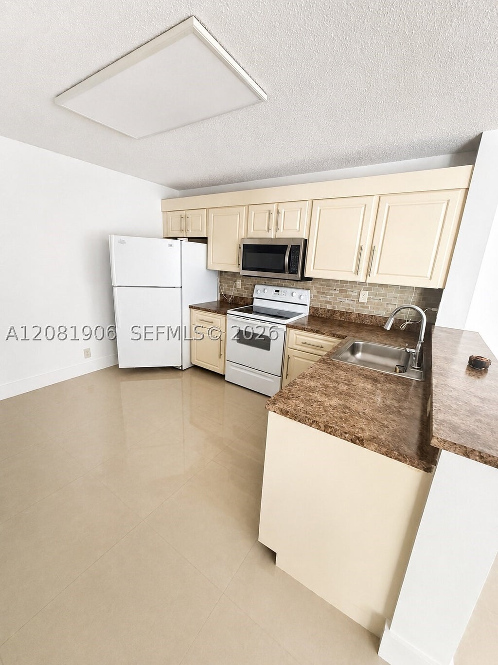 Photo of 10131 W Sunrise Blvd #204, Plantation, FL 33322 (MLS # A12081906)