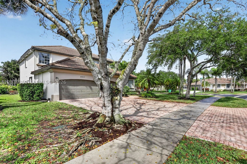 Photo of 4953 Kensington Cir, Coral Springs, FL 33076 (MLS # A12112369)