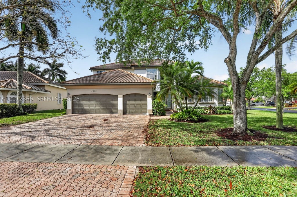 Photo of 4953 Kensington Cir, Coral Springs, FL 33076 (MLS # A12112369)