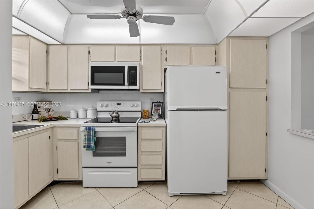 Photo of 3300 W Rolling Hills Cir #302, Davie, FL 33328 (MLS # A11970437)