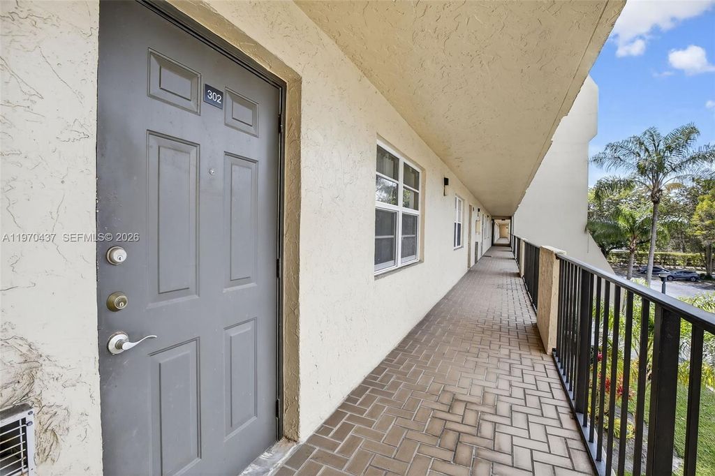 Photo of 3300 W Rolling Hills Cir #302, Davie, FL 33328 (MLS # A11970437)