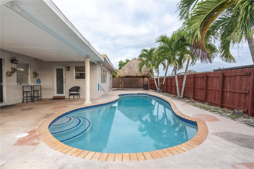 Well maintained, move-in ready, pool home with NO HOA — what more could you ask for? This Pembroke Lakes gem is THE LOWEST PRICED POOL HOME IN PEMBROKE LAKES. There is even extra room space that works great as a 4th bedroom, home office, or guest suite, complete with its own private entrance. Major updates have been completed under permit, including a 2018 roof, 5-ton A/C from 2020, and a gas water heater replaced in 2024. Tucked away on a quiet, residents only street, it is ideal for kids to ride bikes or play outside. Most of the property is outside the floodplain and zoned for top local schools such as Pembroke Lakes Elementary, Walter C. Young Middle, and Charles W. Flanagan High. It's also just one mile from Pembroke Lakes Mall so you will enjoy easy access to shopping, dining, parks, hospitals, and major connection roads like University Drive and Flamingo Road. This home is competitively priced for its size and features, making it is a rare, move-in ready opportunity in Pembroke Lakes.
