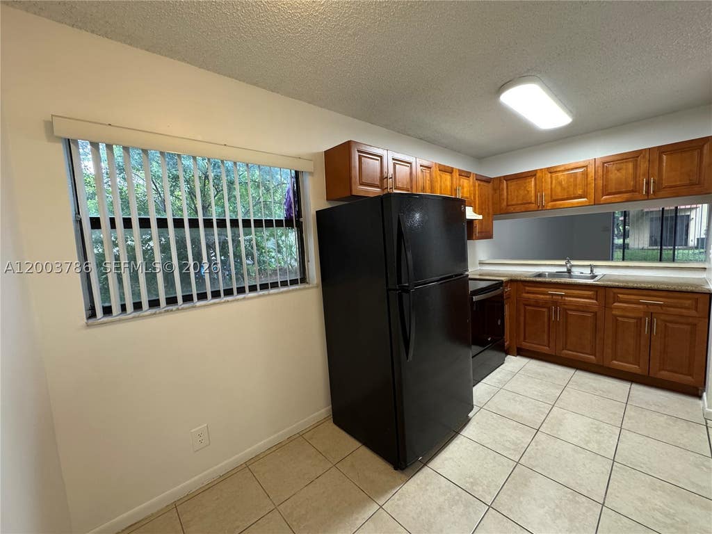 Photo of 4033 Lakeside Dr #4033, Tamarac, FL 33319 (MLS # A12003786)