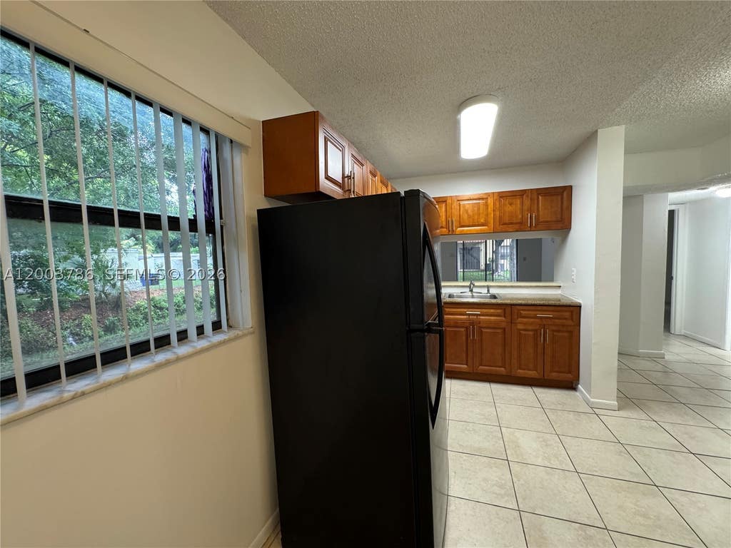 Photo of 4033 Lakeside Dr #4033, Tamarac, FL 33319 (MLS # A12003786)