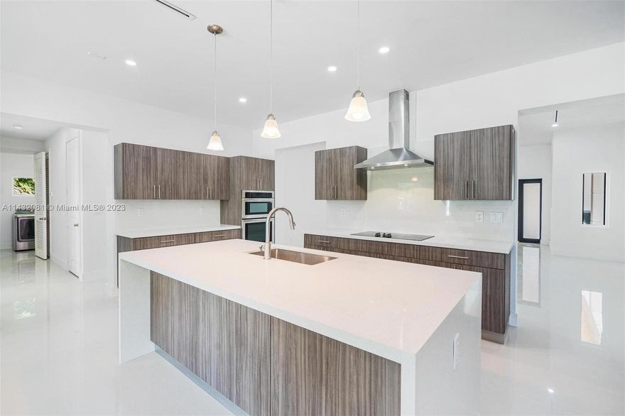 Live your best life here and tap into the potential of an amazing new construction home sitting on over an acre of land in the heart of Kendall. Get comfy in the spacious living room & even cozier in the family room with real working fireplace. Boasting vaulted ceilings with ample natural light which leads to the chef minded designer kitchen with quartz stone tops. Oversized bedrooms and bathrooms with a master bedroom &  bathroom thats ready to provided a spa-like experience. Surrounded by lush tropical landscape gardens with several fruit & vegetable trees and more than enough space to store boats, RV & all your toys. It also comes with a separate guest house "in law quarters" which is currently income producing. Near Dadeland mall, The Falls mall, Kendall Village Center & great schools.