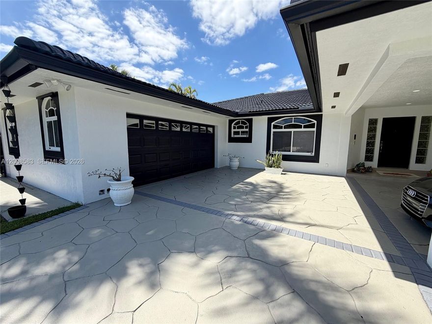 Here is your great opportunity to buy this incredible home and turn it into your dream home. This impressive residence offers a rare combination of space, functionality, and entertainment-focused design in one of South Florida’s desirable areas.
Set on a generous 13,997 sq ft lot, the home features 4,368 sq ft of living space with 5 bedrooms and 4 bathrooms, thoughtfully designed to provide both privacy and open living areas. A standout feature of the property is its exceptional parking and storage capacity, including a 2 car garage in the front of the home and an additional detached 2 car garage in the rear, connected with through doors along the left side of the house, for a total of 4 garage spaces. Inside, the home offers multiple distinct living and entertaining spaces, including a family room, a formal dining room, and a separate bar and dance floor room designed for hosting and entertainment. The layout includes a private master suite located on the second floor, creating a quiet and separated retreat from the main living areas. Outside, the property provides plenty of space to build a custom pool and pergola, offering excellent potential to create a resort style backyard. This home presents a rare opportunity in Miami with size, flexibility, and strong entertainment features throughout.  Call today as this will not last.