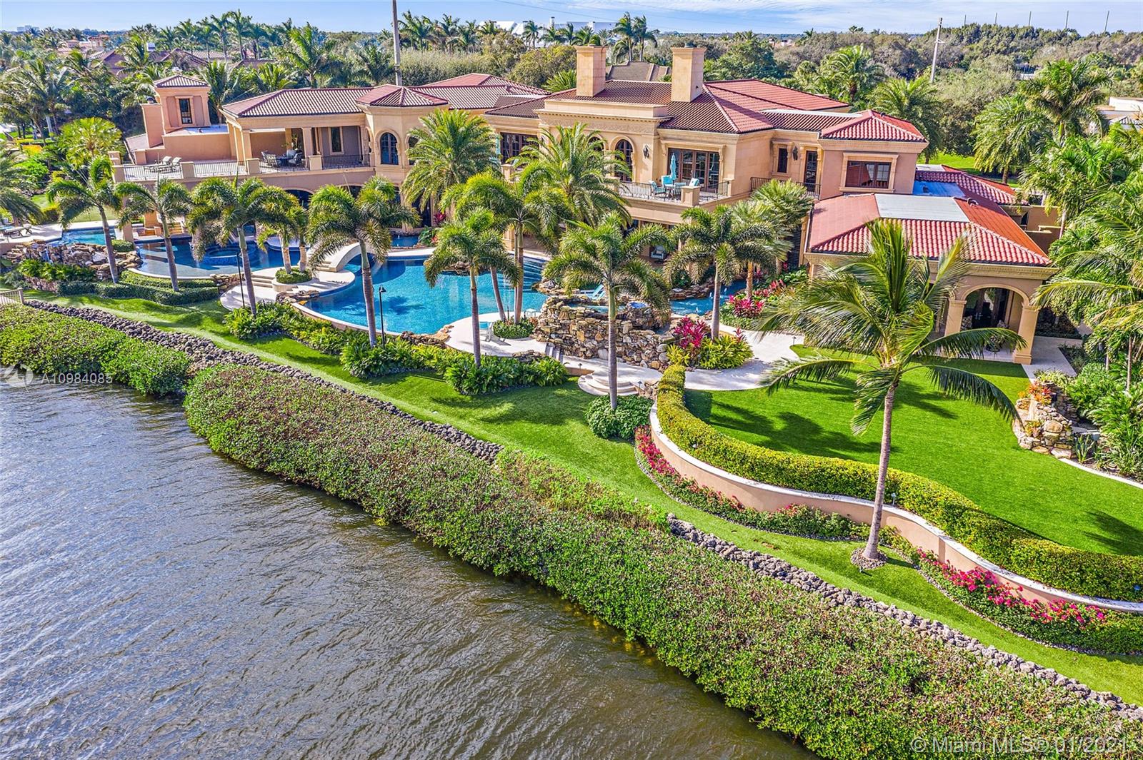 TROPHY PROPERTY The largest Intracoastal property in Admirals Cove. If you like toys this is your home. This majestic property boasts over 365' of prime protected waterfrontage for a Mega Yacht, has a garage for over 25 cars plus a motor coach and is situated on almost 1.5 acres. This house was built to stand the test of time. Enjoy countless hours outdoors under oversized loggias with TV, swim up bar with sunken kitchen, pedestrian bridge with waterfalls, 2 hot tubs, fire bowls all overlooking the Intracoastal. The master suite is fit for a King and Queen with separate baths, closets and morning bar. Her bath has oversized jacuzzi tub, dual vanities, shower, custom cabinetry, and detailed ceiling. His bath has steam shower with heated shower lounger and custom cabinetry.