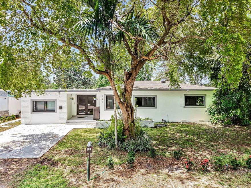 Welcome to this stunning 4-bedroom, 3-bath home on an oversized corner lot in desirable North Miami Beach. This home offers two primary bedroom suites with private baths, including one with its own entrance—perfect for an in-law suite, guest quarters, or potential rental income. The open layout includes a modern eat in kitchen with quartz counters and stainless-steel appliances. Recent upgrades feature a new electrical panel and wiring, automated LED lighting, remodeled baths with PVC plumbing, impact windows and doors, and vinyl flooring with tile in baths. The fenced backyard is great for relaxing, entertaining, or adding a pool. Close to beaches, highways, dining, downtown Miami & Ft Lauderdale. No HOA, City permit in place for Airbnb. Move-in-ready home with attention to every detail.