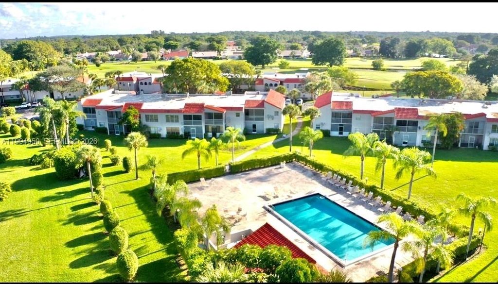 Photo of 7435 Woodmont Ter #202, Tamarac, FL 33321 (MLS # A11994950)