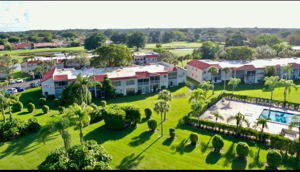 Photo of 7435 Woodmont Ter #202, Tamarac, FL 33321 (MLS # A11994950)