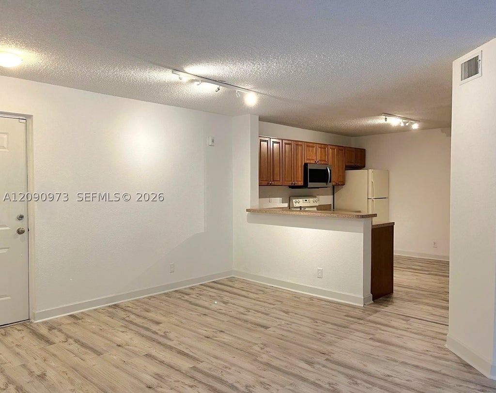 Photo of 10161 W Sunrise Blvd #203, Plantation, FL 33322 (MLS # A12090973)
