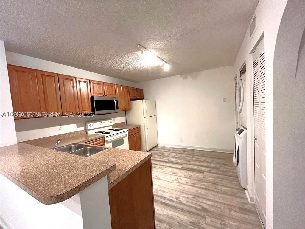 Photo of 10161 W Sunrise Blvd #203, Plantation, FL 33322 (MLS # A12090973)