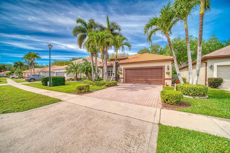 Stunning 3 bedroom 2 bathroom home offers luxury and comfort in esteemed Polo Trace community. The York Model, is the largest one story in this section of the community.  This residence boast elegance and abundance of natural light throughout.  Beautiful custom wood cabinets and marble counter tops with stainless steel appliances ideal for entertaining family & friends.  Elegant tile, high ceilings.  Living in Polo trace features upscale amenities such as resort style pool, fitness center, full service restaurant, six clay tennis courts, four pickleball courts and two bocce courts. 24 hour manned guard gate, Comcast TV & internet & lawn care.