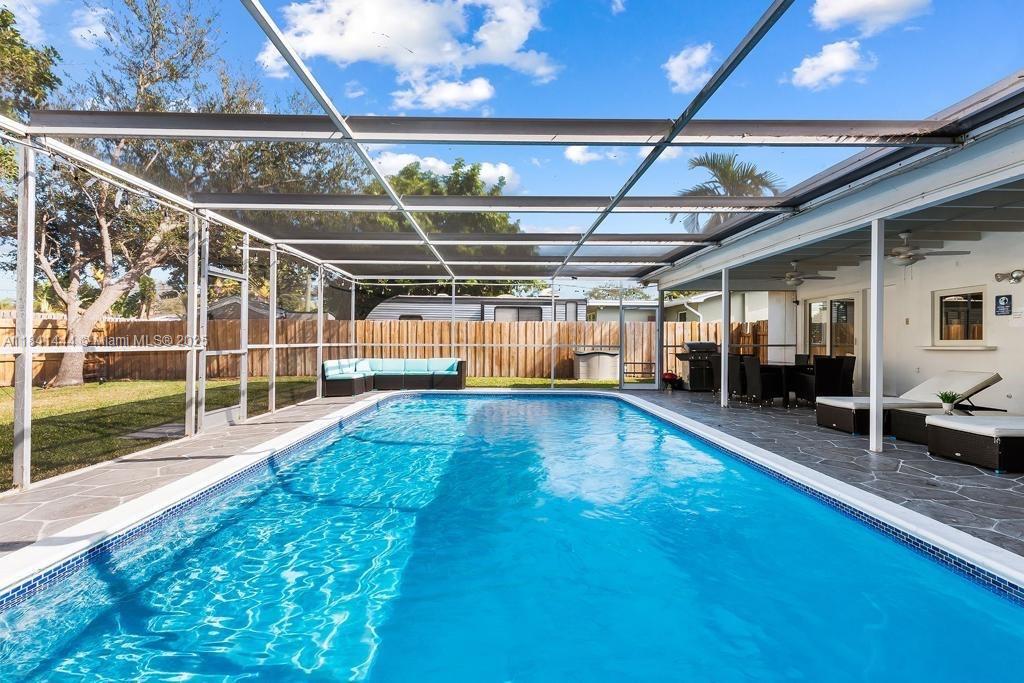 Fully renovated Hollywood with heated pool! The ultimate living experience offered by this perfectly renovated and furnished home, with top-of-the-line appliances and a brand new air conditioning system. The amazing backyard serves as a perfect place for unwinding and hosting gatherings. Featuring a newly installed heated pool, a huge Garden and a 10,000 SQFT lot. For families with small children, a baby gate is provided for added safety. Step inside to discover a modern design adorned with upscale finishes. Quartz counter tops and TWO Sinks. Ample parking space for four cars. Situated in close proximity to houses of worship, supermarkets, and schools, this amazing property is perfect for you and your family. Reach out for your private showing.