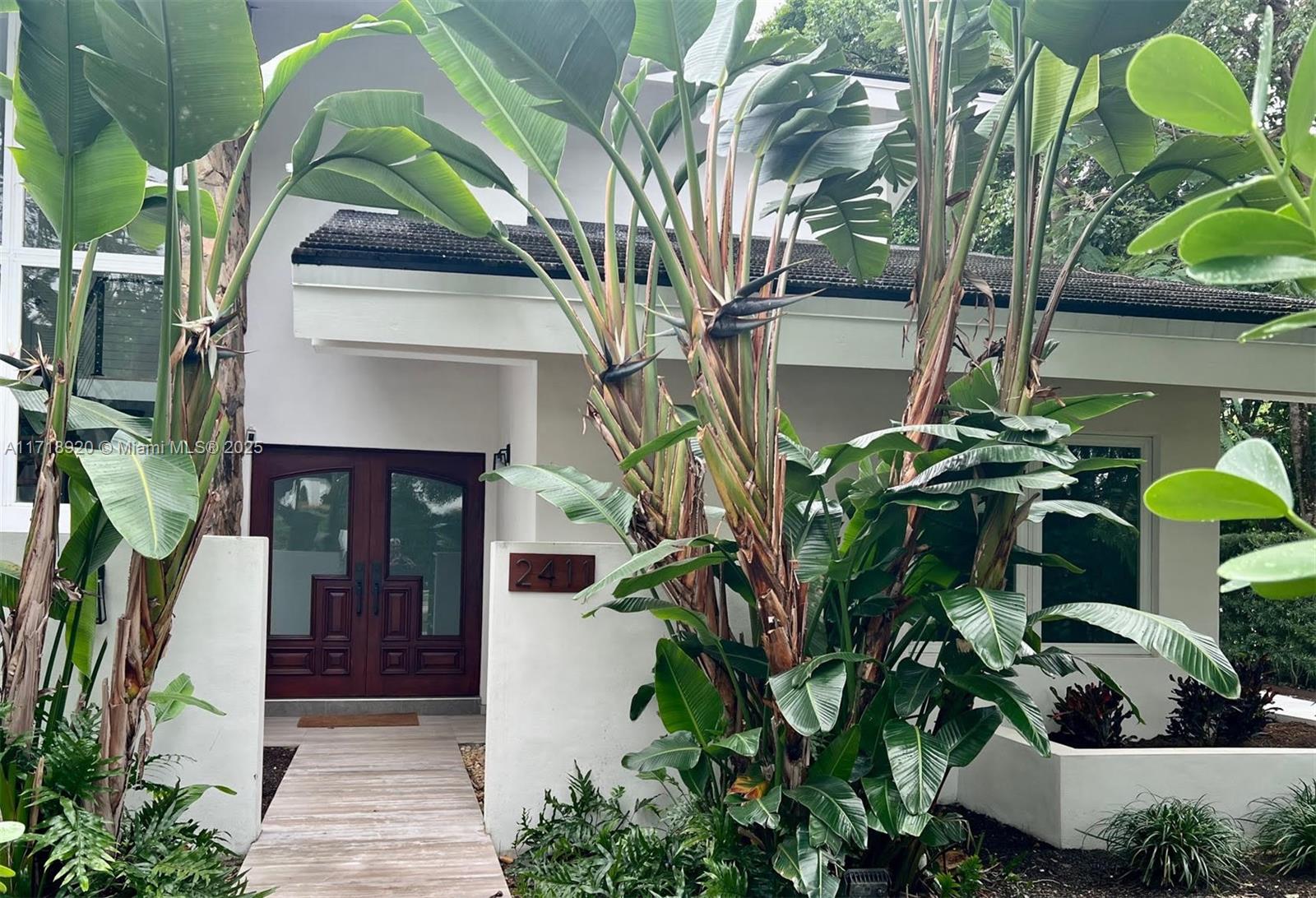 BRICKELL gated house on historical South Miami Ave- a true rarity! 4bd/3ba all updated plumbing, electrical, new roof, 2 a/c units, impact wds/doors, roof, kitchen, baths. Expansive 1st floor with open layout, spacious kitchen w/gas top island, food steamer, bar, family room, formal living/dining and 1bd w/full bath, laundry room, 2car gar, and a magnificent outdoor area perfect for entertaining! A modern floating wood staircase leads to the 2nd story featuring the Master bd/ba with spa-like jacuzzi & rain shower, separate his/hers walk-in closets, + 2 additional bedrooms with J-n-J bath. AMAZING TURNKEY LIVING! Walk to the beach, Alice Wainwright park, jog to Key Biscayne,take trolley to the Financial District, or a short drive to the Grove, marinas, MidTown and all w/ EASY I-95 access