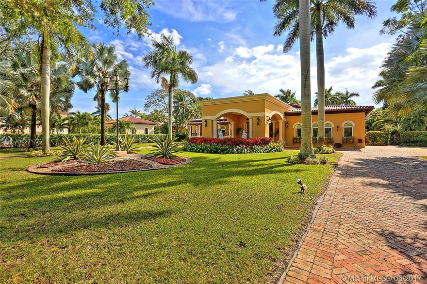 Tuscan inspired Masterpiece. Better than Brand New! Newly refined and refurbished with exemplary details! Exquisite and Elegant! Open and airy! Grand open floor plan. Unsurpassed finishes and craftsmanship featuring gleaming Crema-marfil marble and hardwood floors. Elegant living and dining rooms. High volume ceilings. Lavish master suite. Media room. Separate office with exquisite built-ins. Magnificent vistas to inviting open pool and cabana. BBQ/summer kitchen. Generator. Lush landscaping with tropical plantings. Sensational!