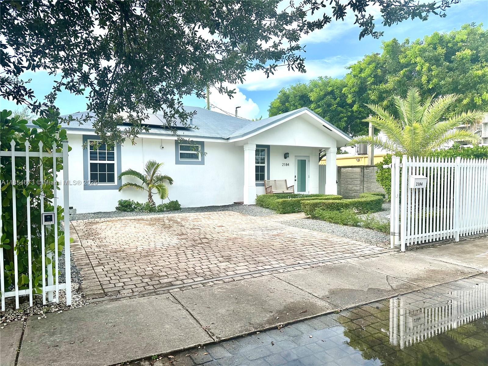 Incredible single-family home with high end finishes throughout. This one-of-a-kind gem has many characteristics found in a luxury custom built home. Impeccable property featuring 3 Bedrooms and 2 Bathrooms with an open floor plan, great for entertaining. Additional interior features include: porcelain floors, custom built kitchen wood cabinetry with granite counter tops, modern bathrooms with oversized rain shower heads and custom-built cabinetry, high ceilings, impact windows/doors, and interior washer and dryer.
Step outside to your tailored backyard (low maintenance - artificial turf) boasting plenty of space to entertain and/or for the kids to play. Privacy fence, electric car charging station in driveway, electric driveway gate, impact doors and windows, and so much more.....
