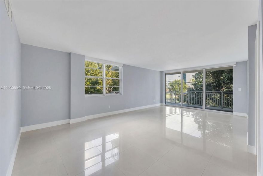 Welcome to refined island living in the heart of Bay Harbor Islands.
This elegant, renovated, boutique residence offers approximately 1,000 square feet of thoughtfully designed living space, combining comfort, style, and tranquility. Step into a bright, open-concept layout filled with natural light from its desirable eastern exposure and enhanced by sound-proof impact windows for peaceful everyday living. This corner hit faces NE where bay views can be seen from the balcony.

This desirable corner unit features a spacious primary bedroom, 1.5 bathrooms, extra den that can be used as an office or an extra room, and a well-appointed kitchen complete with dishwasher, microwave, electric range, refrigerator, and a generous pantry—perfect for both everyday cooking and entertaining.
Unwind on your private balcony while enjoying calming water and city views, ideal for morning coffee or evening relaxation.

Residents enjoy resort-style amenities including a bayfront swimming pool, social room, additional storage, and one assigned parking space. Perfectly situated directly across from Ruth K. Broad Bay Harbor K-8 Center, and within walking distance to dining, shopping, banks, and just minutes from the beaches, this home delivers the perfect blend of convenience and coastal lifestyle.

A wonderful opportunity to own in one of Bay Harbor Islands’ most desirable boutique communities.