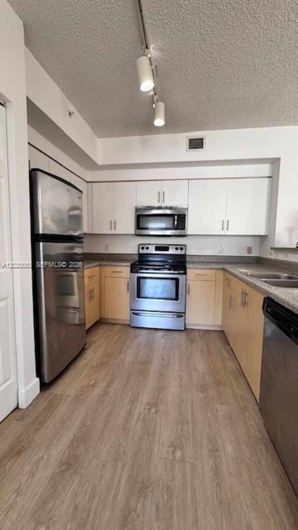 Photo of 7930 N Nob Hill Rd #106, Tamarac, FL 33321 (MLS # A12023083)